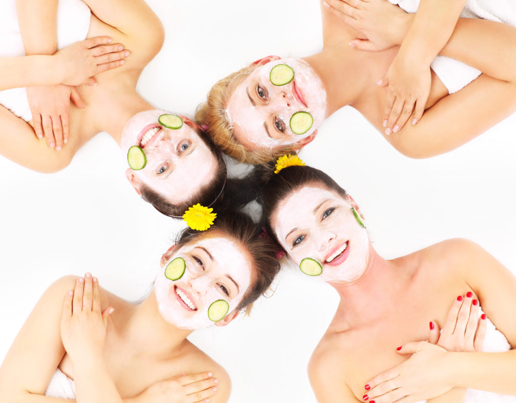young women with cosmetic face masks